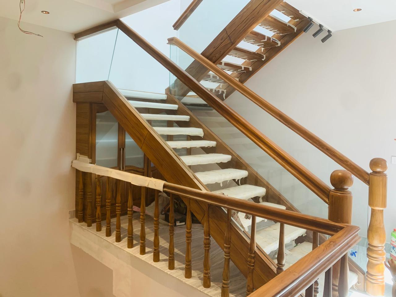 Wooden Staircase with Glass Railing